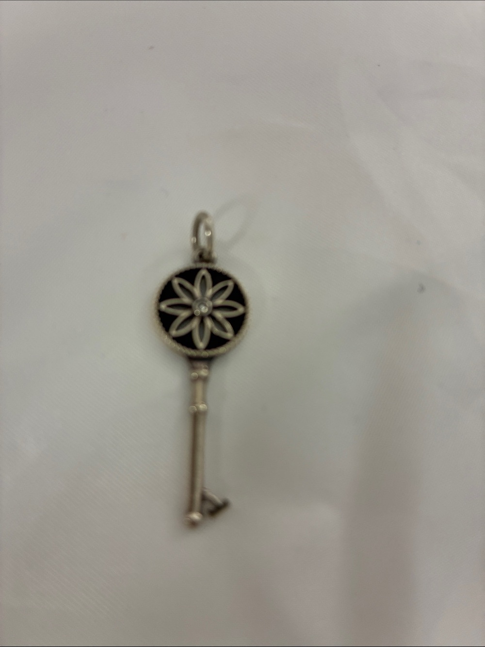 Tiffany & Co. Silver-Tone Key Pendant with Black Enamel Flower